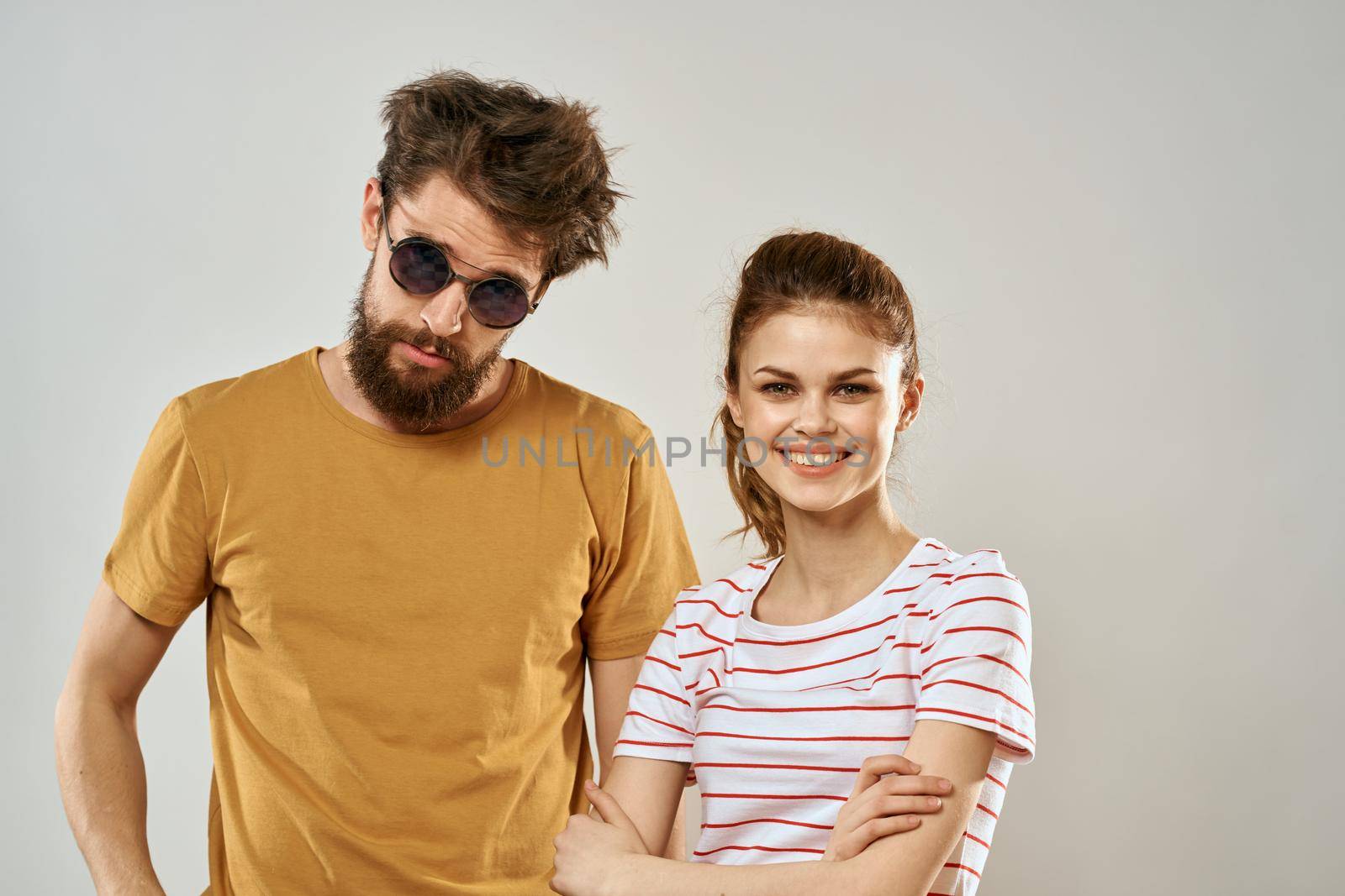 Young couple socializing romance lifestyle fashion fun light background by SHOTPRIME