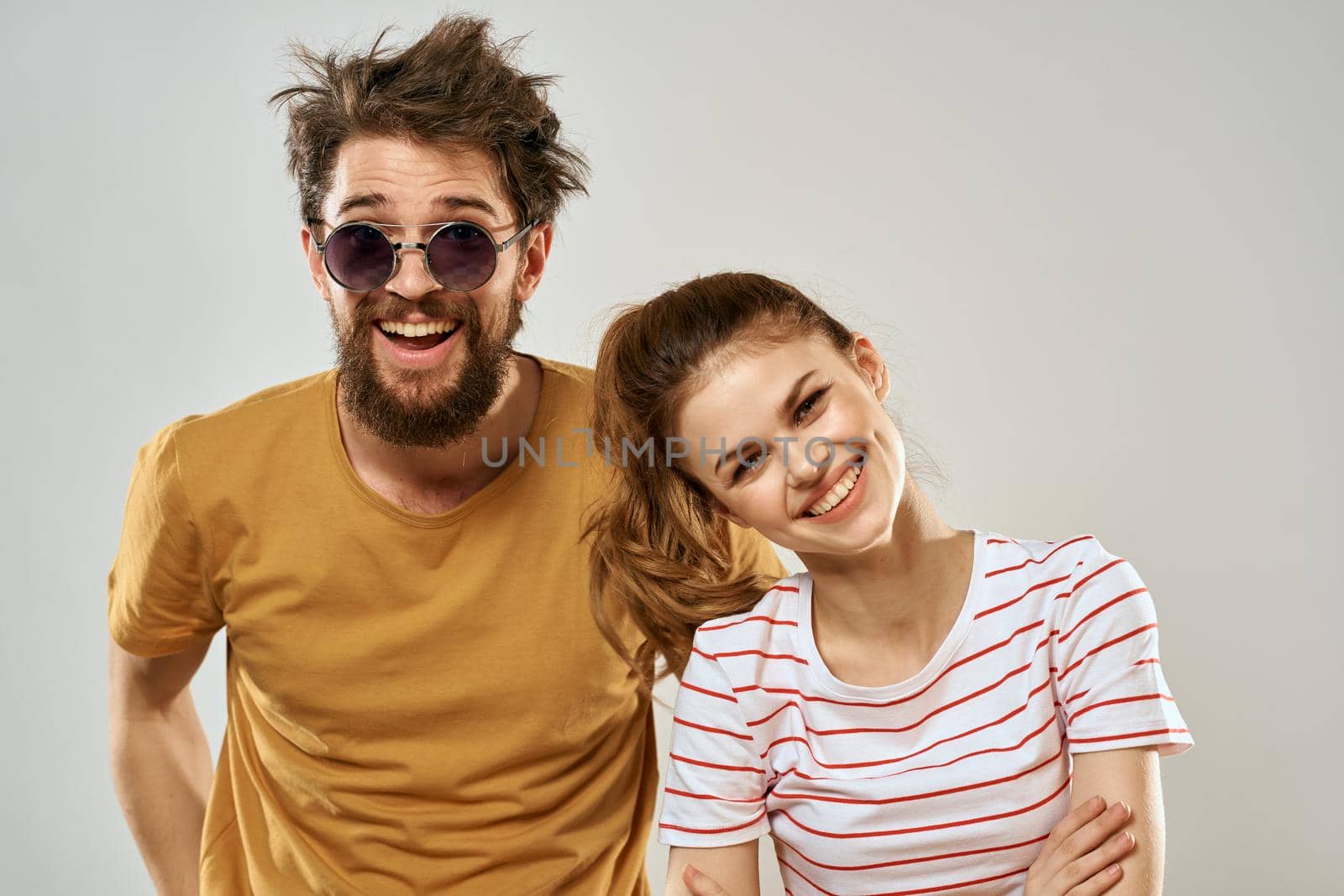 Man in sunglasses next to woman in communication fun friendship lifestyle. High quality photo