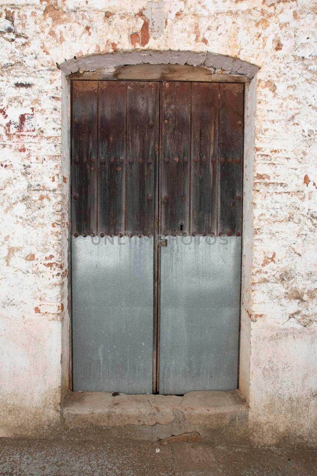 old door in a town house by loopneo