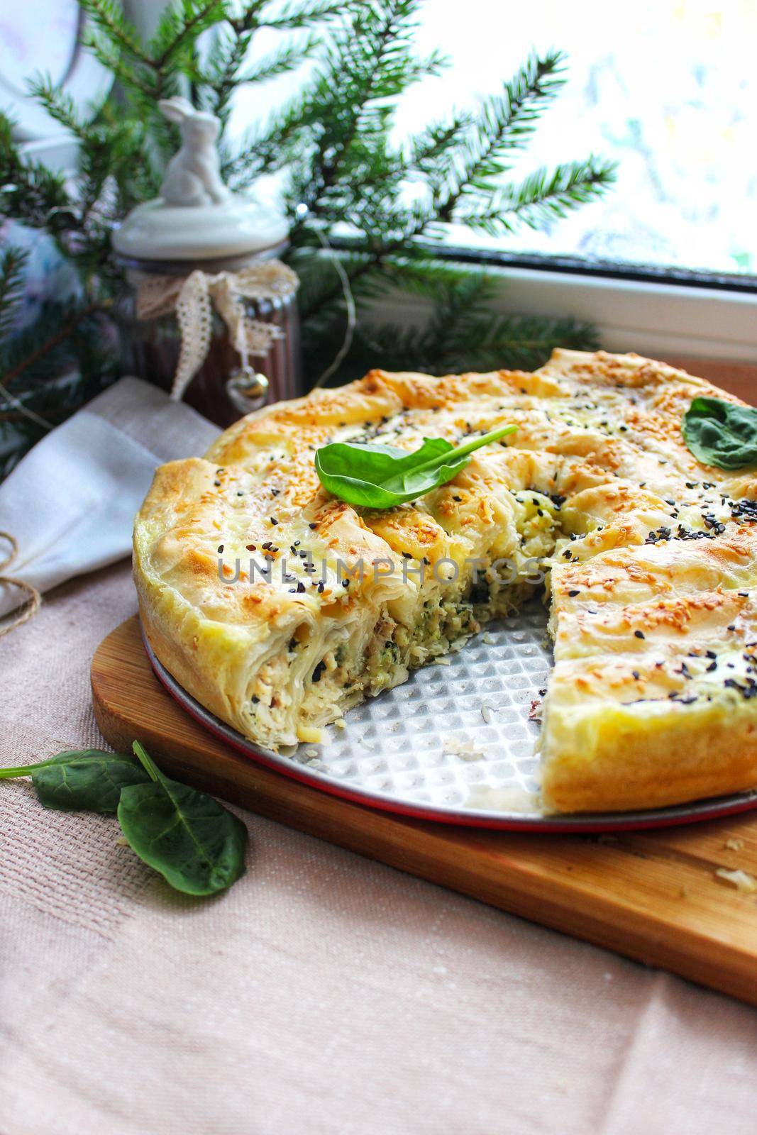 Close-up of baked lasagna in a ceramic plate with a piece cut off.Texture or background