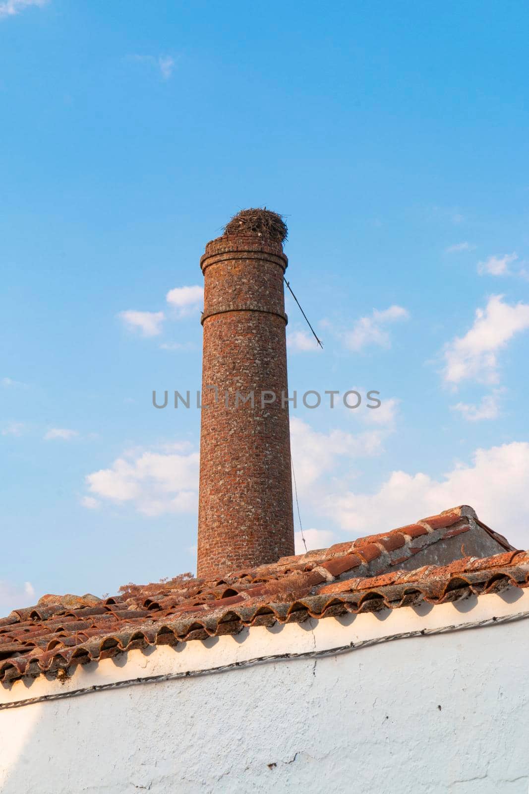 Old chimney of an abandoned factory in southern Spain, with a nice blue sky