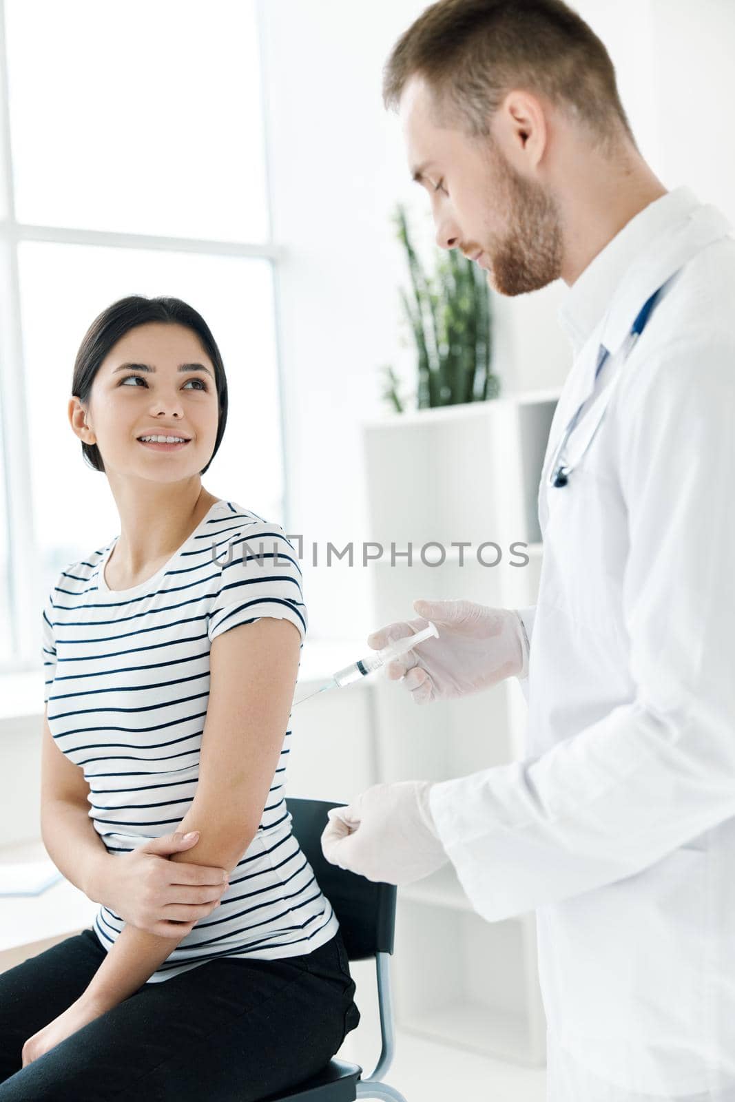 male doctor holding an injection coronavirus health. High quality photo