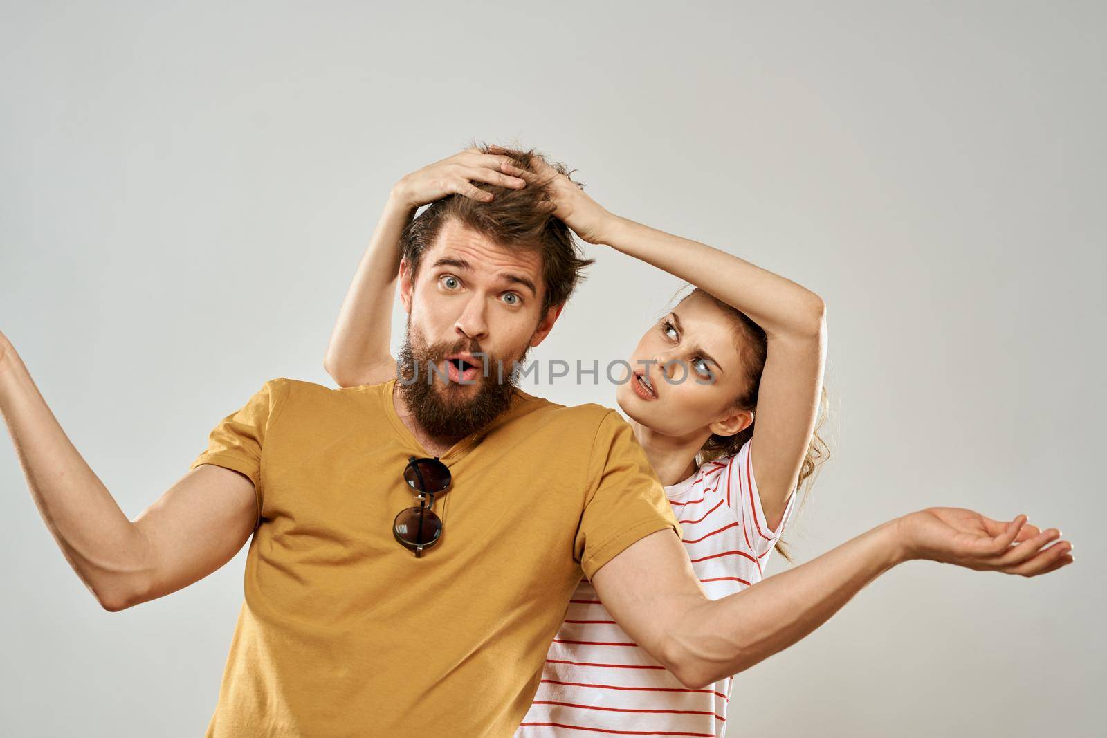 Young couple socializing romance lifestyle fashion fun light background by SHOTPRIME