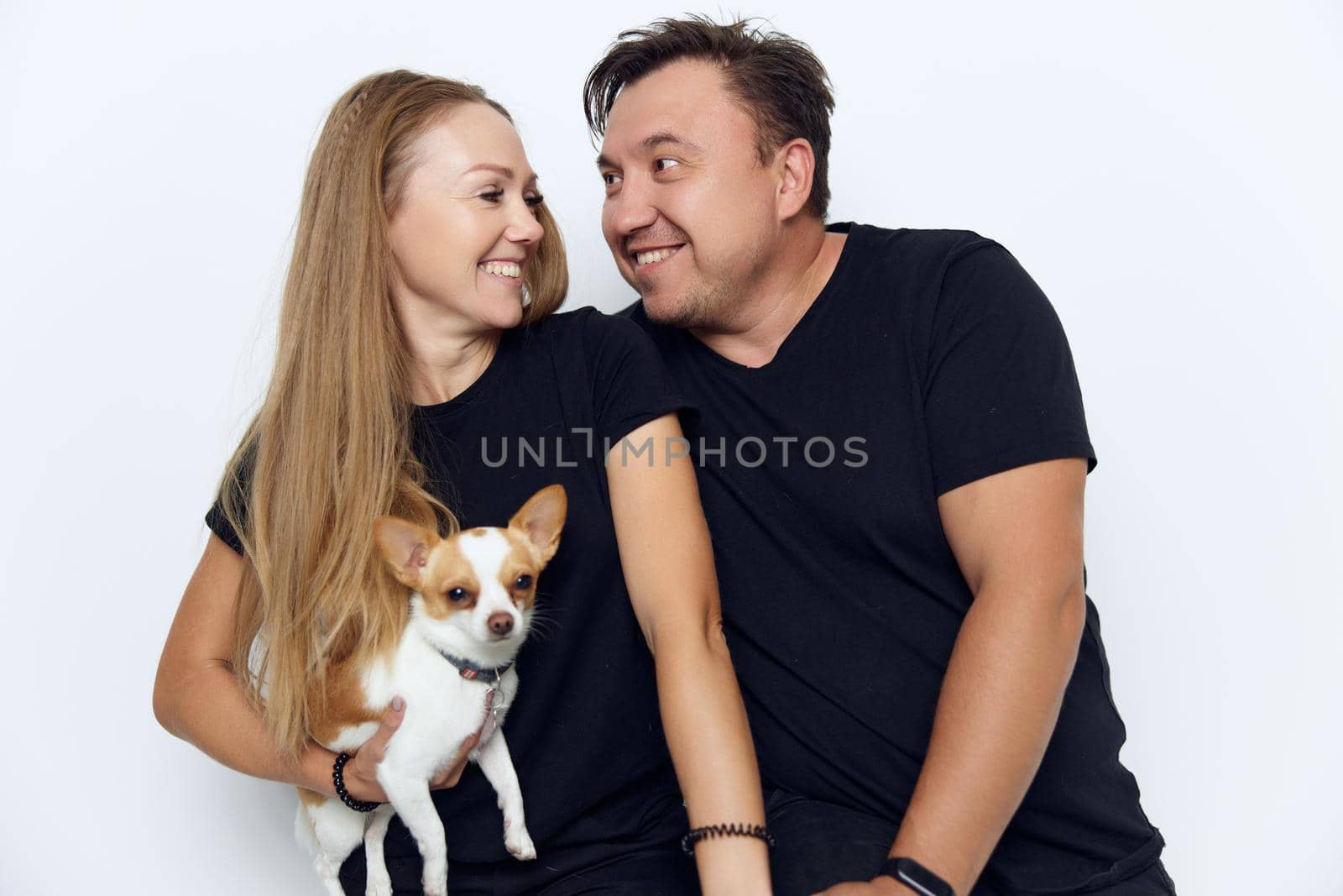 married couple husband with wife small dog. High quality photo