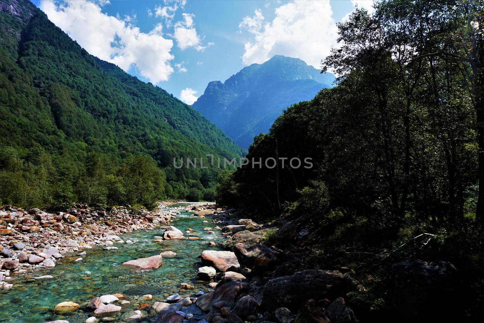 Turquoise Verzasca river flowing through beautiful Swiss landscape