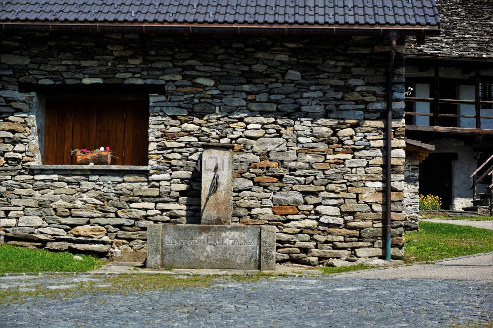 Fountain in the picturesque village center of Frasco, Verzasca Valley, Ticino, Switzerland