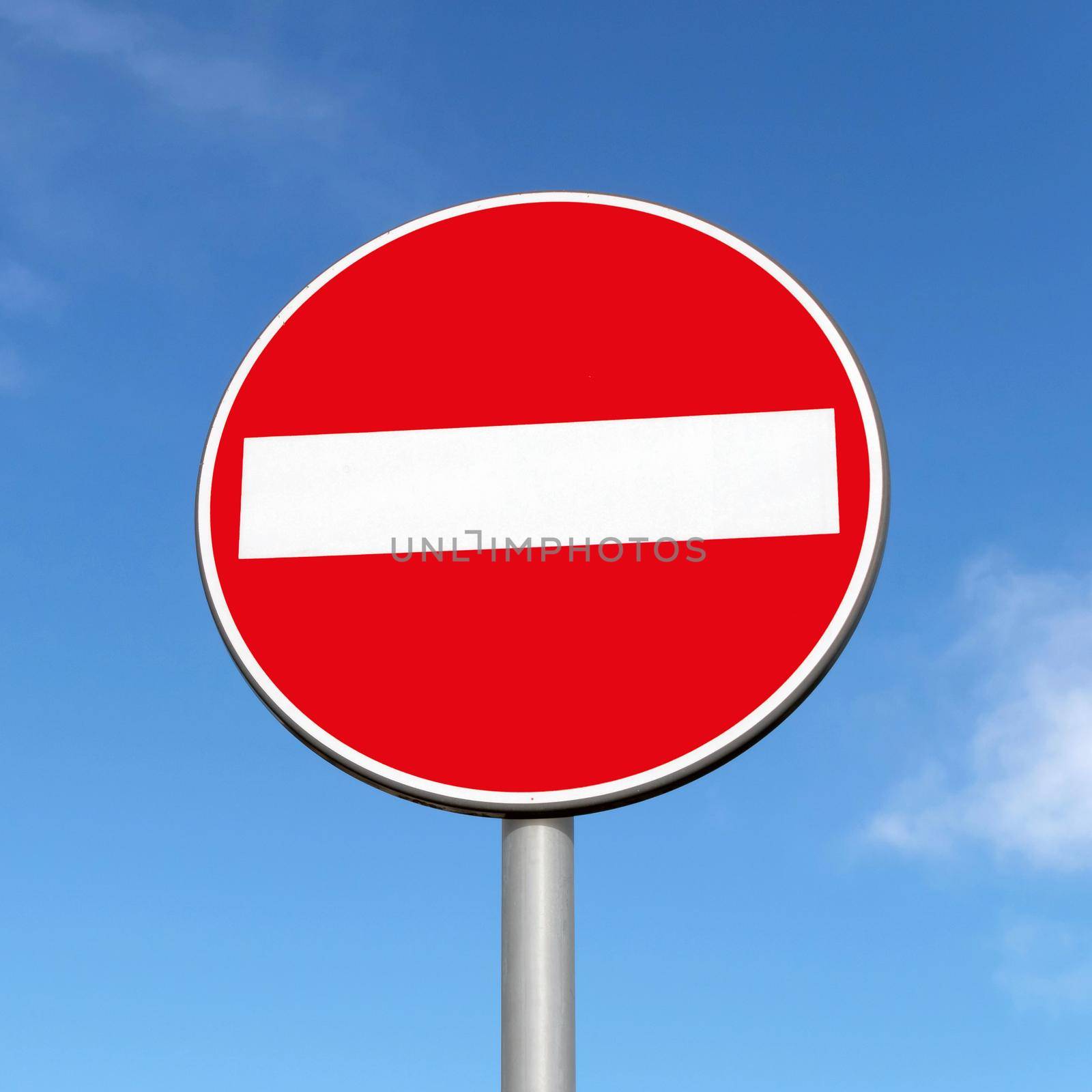 No entry road sign on a blue sky background