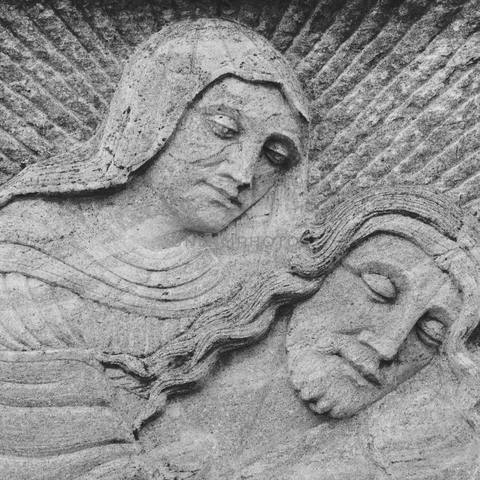 Ancient Bas-relief of Virgin Mary And Jesus. It can be used as concepts and events.