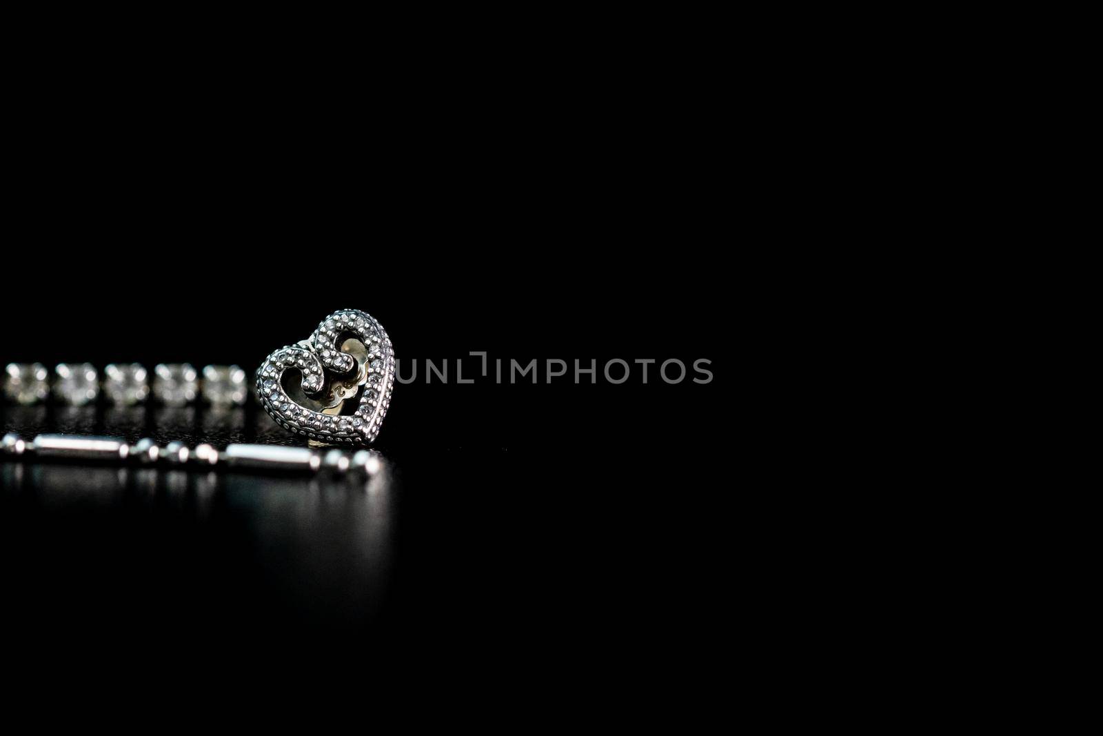 Beautiful silver jewelry isolated on black, close up