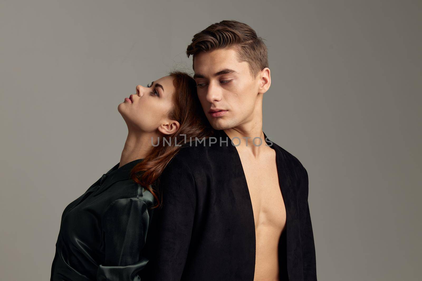 young couple standing next to luxury romance passion and sensuality. High quality photo