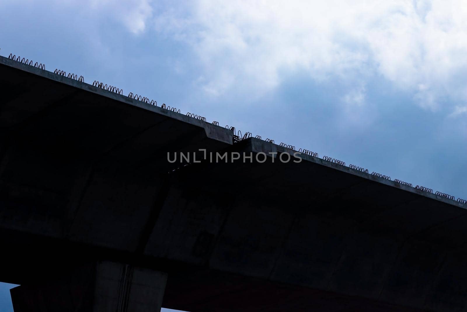 Silhouette of expressway under construction.