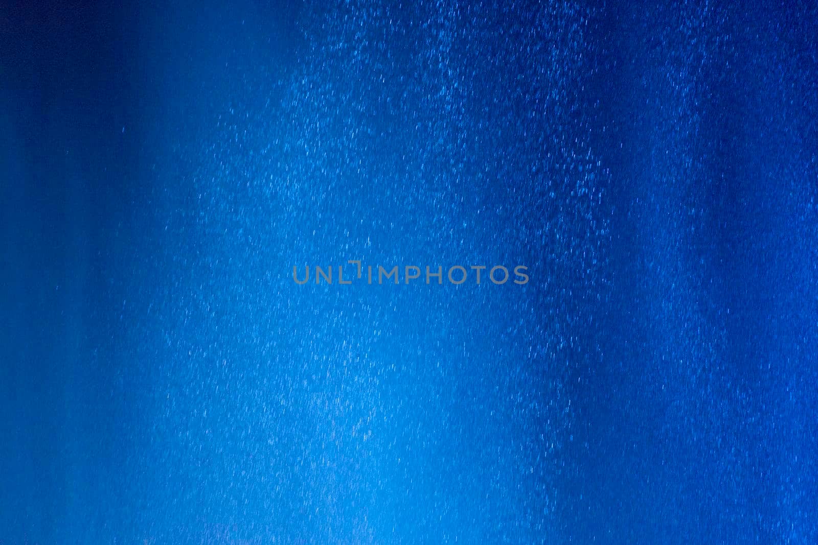Abstract background of water drops in neon lighting. For design and networking.