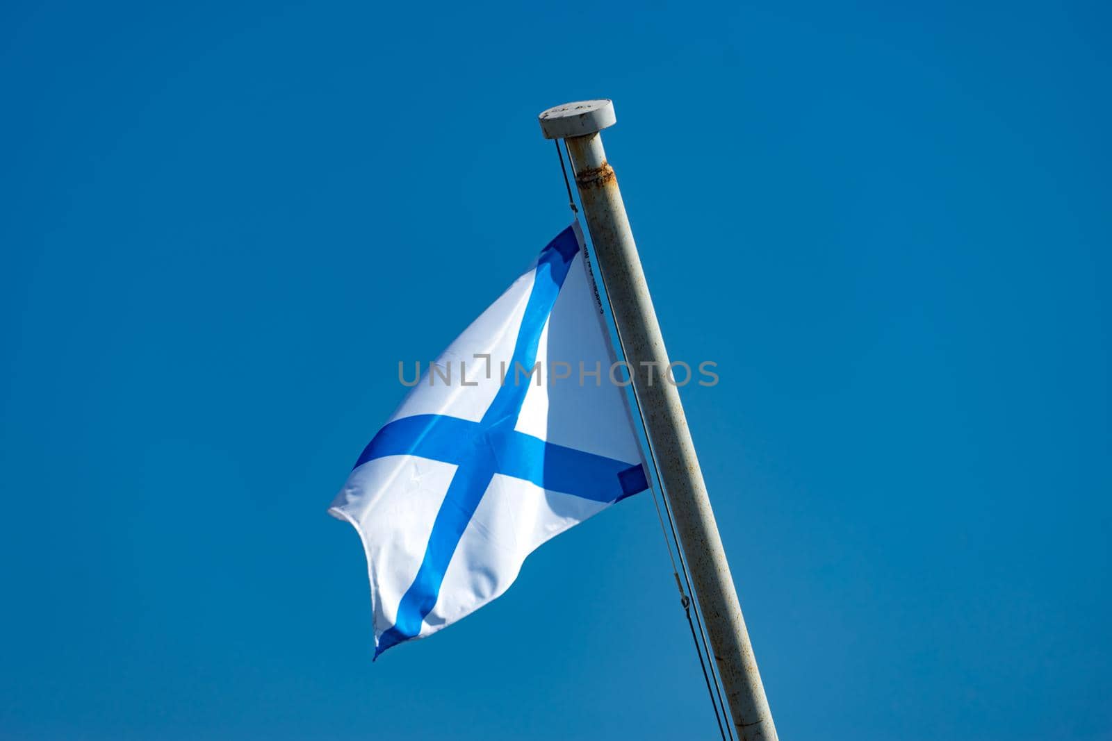 Vladivostok, Russia. Naval flag on blue sky background