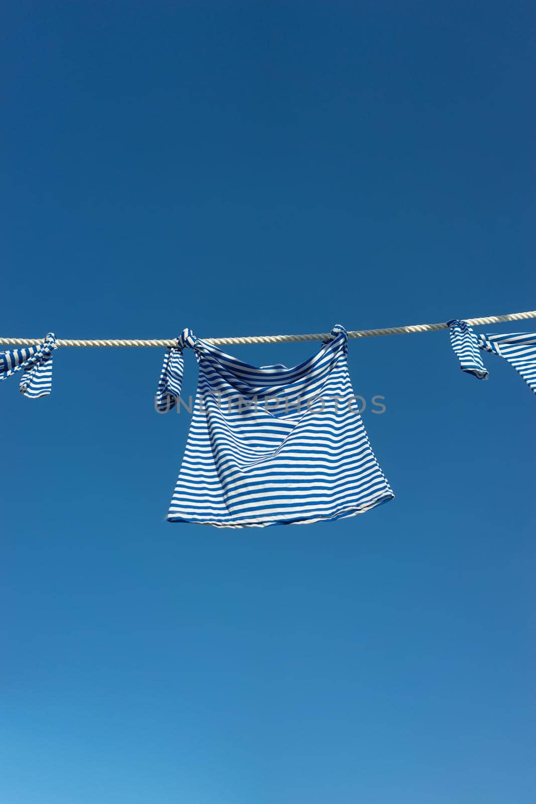 sea vest on a rope against the blue sky. For design and networking