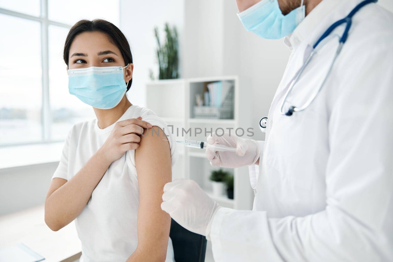 female patient medical masks in hospital and shoulder injection epidemic vaccine by SHOTPRIME