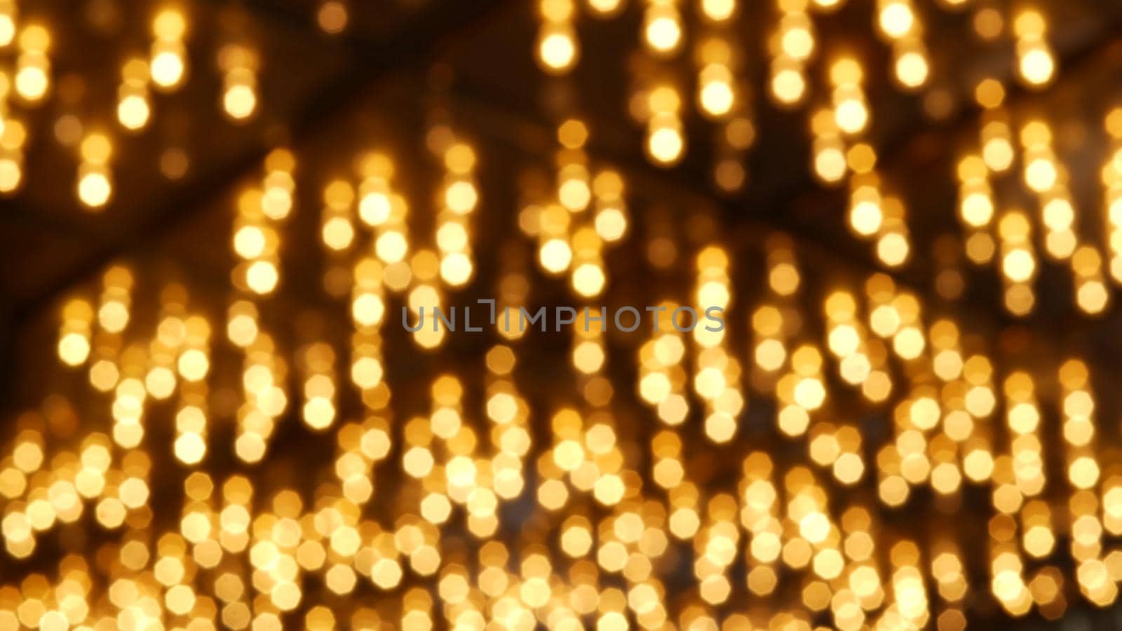 Defocused old fasioned electric lamps glowing at night. Abstract close up of blurred retro casino decoration shimmering, Las Vegas USA. Illuminated vintage style bulbs glittering on Freemont street.