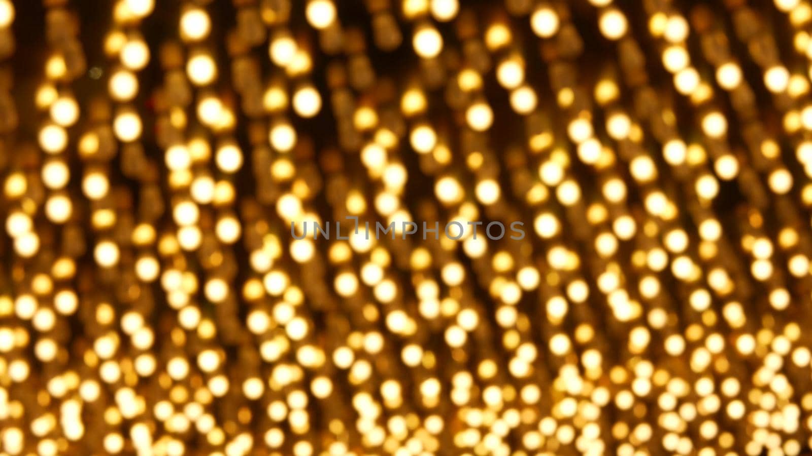 Defocused old fasioned electric lamps glowing at night. Abstract close up of blurred retro casino decoration shimmering, Las Vegas USA. Illuminated vintage style bulbs glittering on Freemont street.