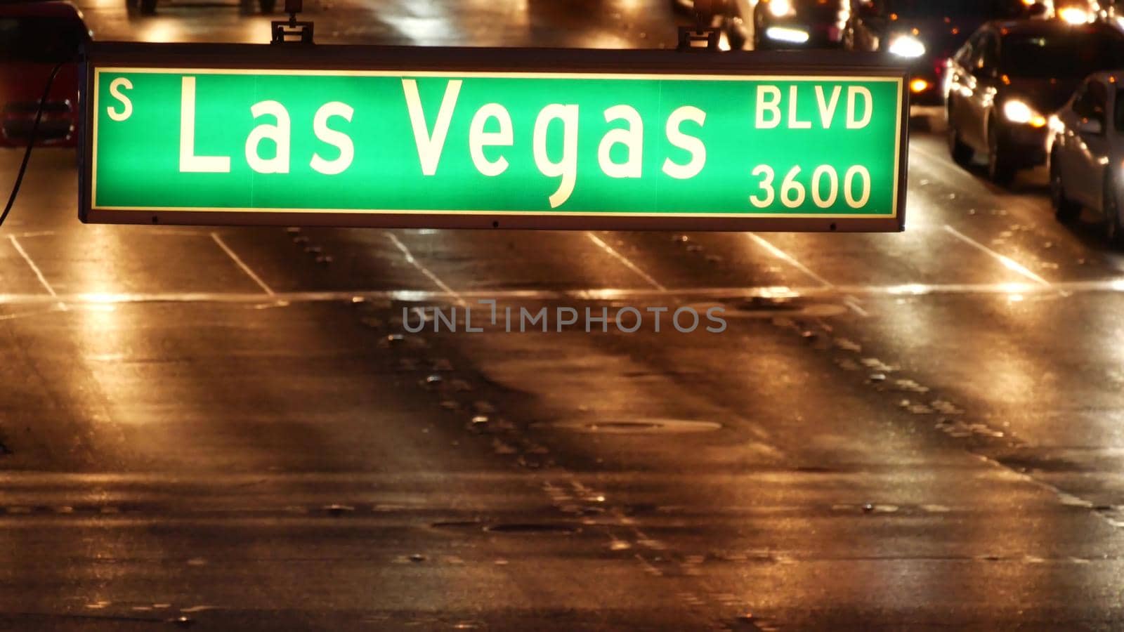 Fabulos Las Vegas, traffic sign glowing on The Strip in sin city of USA. Iconic signboard on the road to Fremont street in Nevada. Illuminated symbol of casino money playing and bets in gaming area.