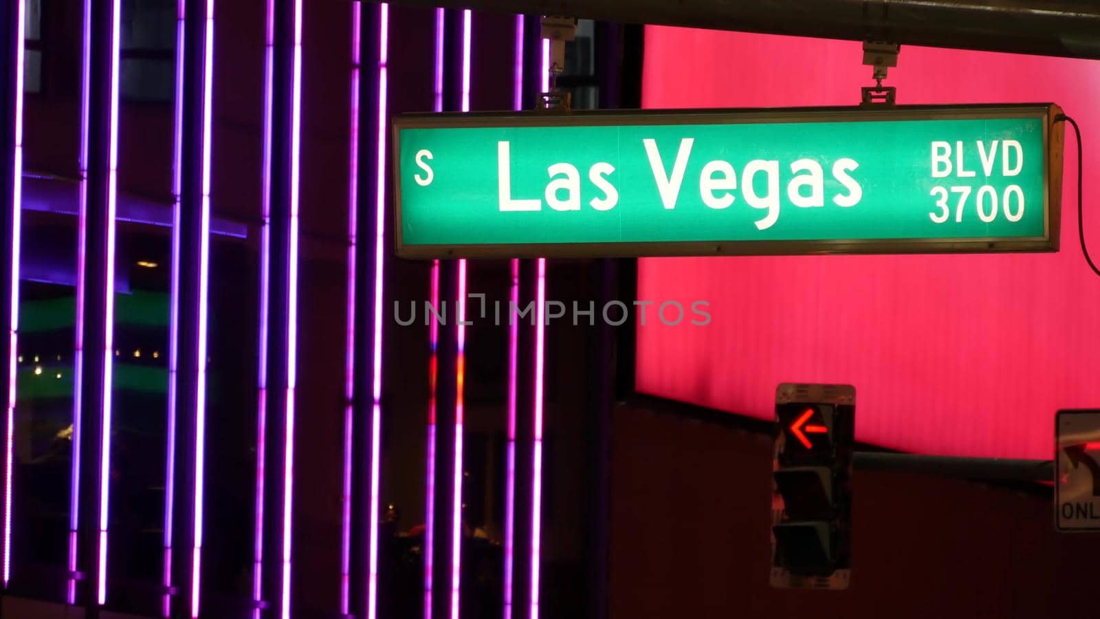 Fabulos Las Vegas, traffic sign glowing on The Strip in sin city of USA. Iconic signboard on the road to Fremont street in Nevada. Illuminated symbol of casino money playing and bets in gaming area.