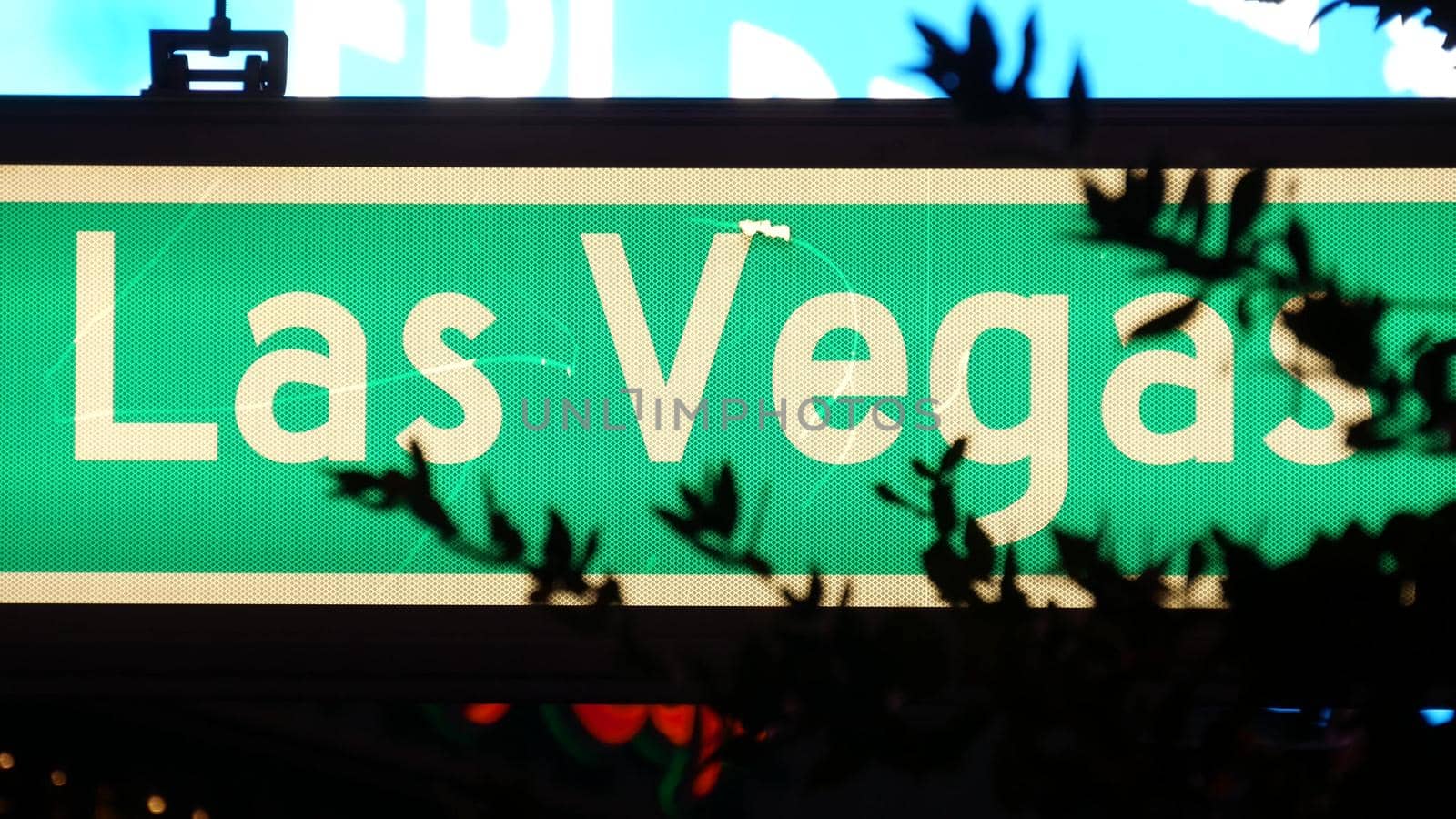 Fabulos Las Vegas, traffic sign glowing on The Strip in sin city of USA. Iconic signboard on the road to Fremont street in Nevada. Illuminated symbol of casino money playing and bets in gaming area.