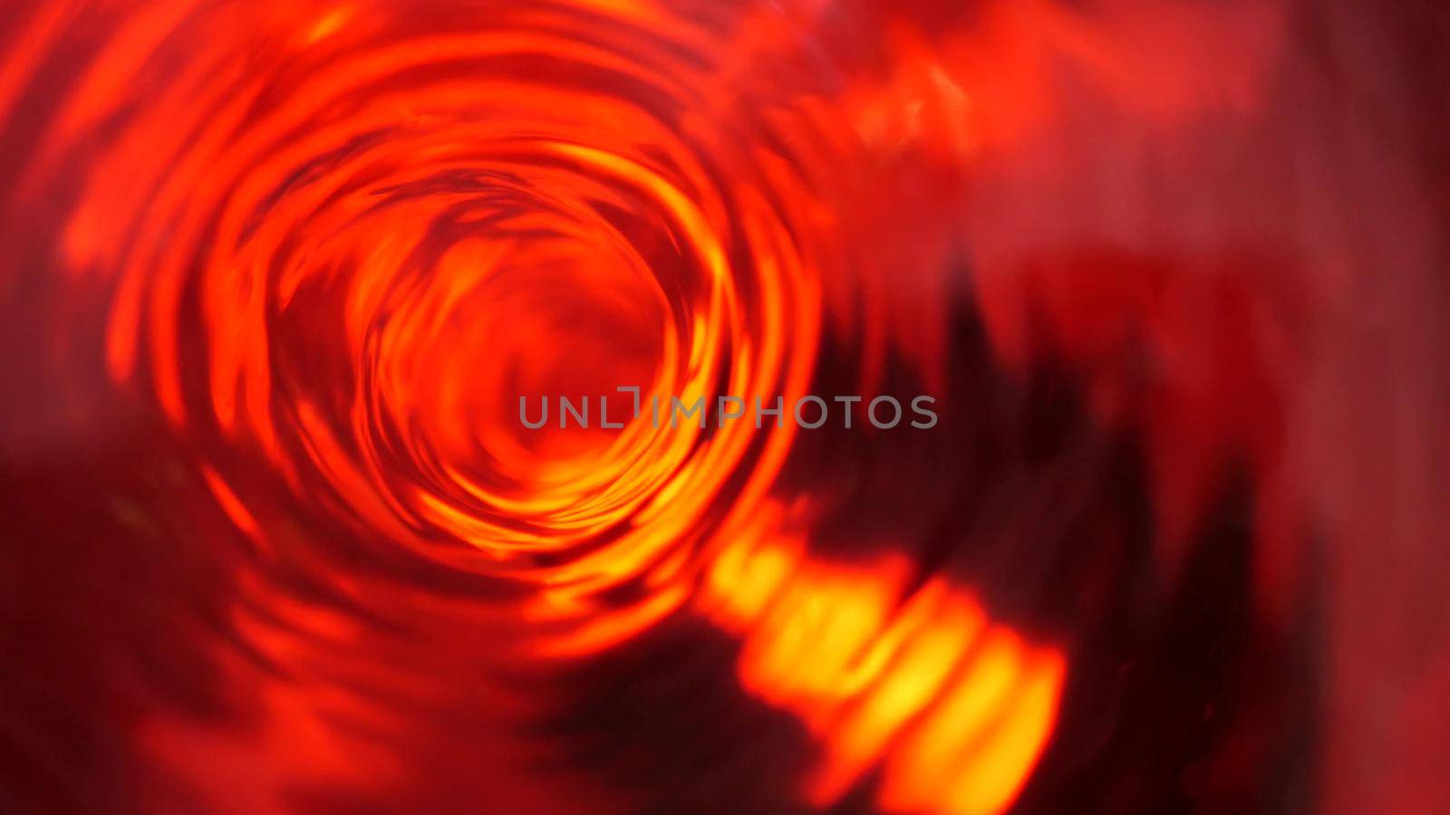 Symbol of hell, inferno and infinity. Red liquid hypnotic looped aqua swirl turning. Meditative luminous whirlpool. Mesmerising spiral tunnel of crystal fluid. Fiery surreal rhythmic water gradient.