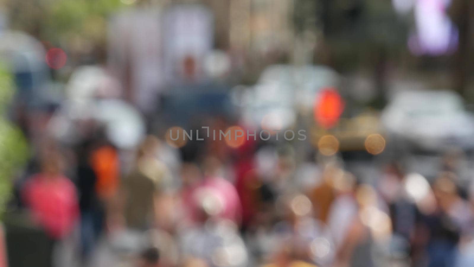 Defocused crowd of people, road intersection crosswalk on The Strip of Las Vegas, USA. Anonymous blurred pedestrians on walkway in crowded urban downtown. Unrecognizable american citizens in sin city.
