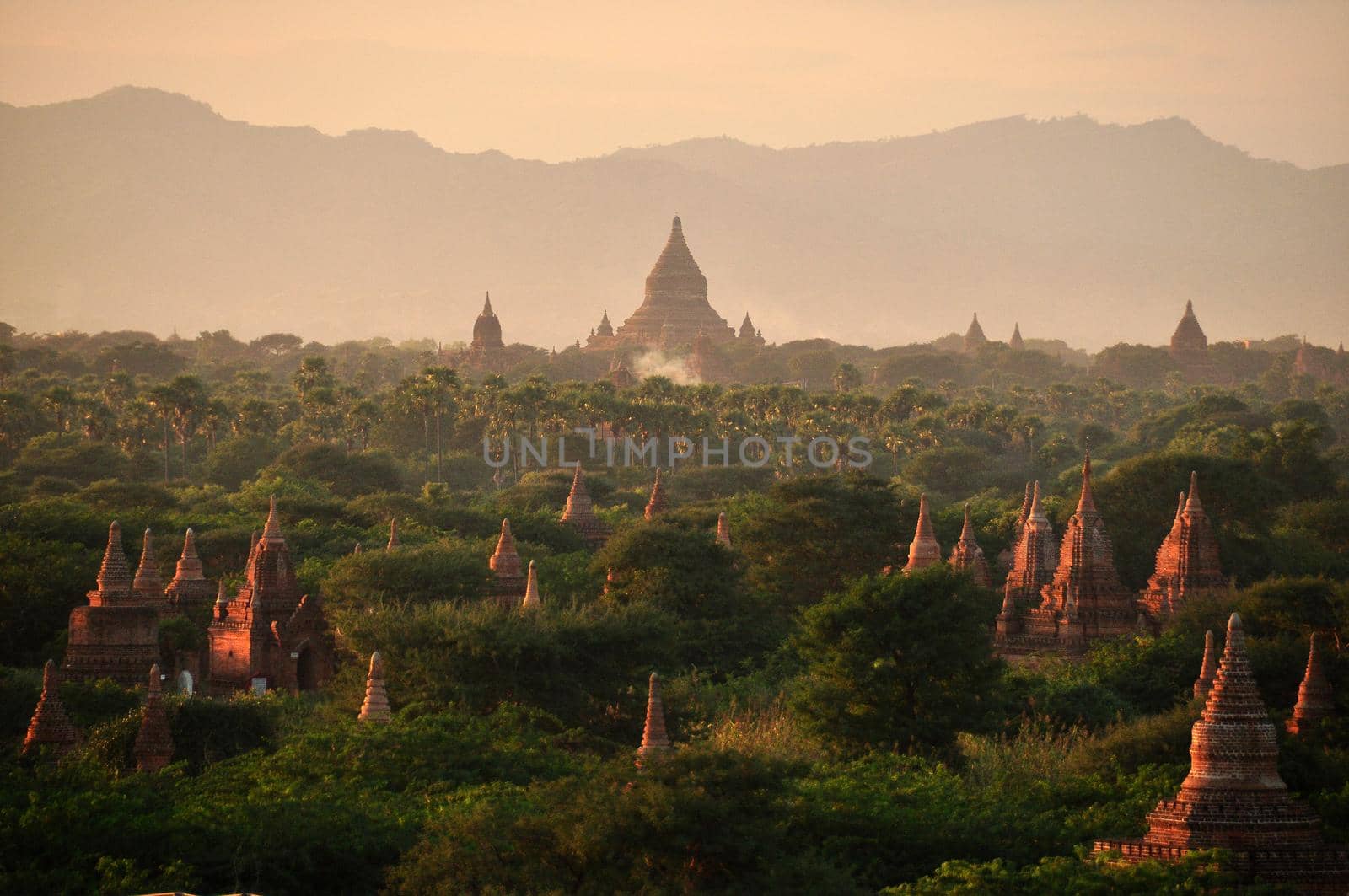 Green land with spears of temple, Picturesque landscape of green spacious terrain with spires of oriental pagodas and paya, Myanmar, Bagan. Mingalazedi Sulamani Shwezigon Ananda Htilominlo