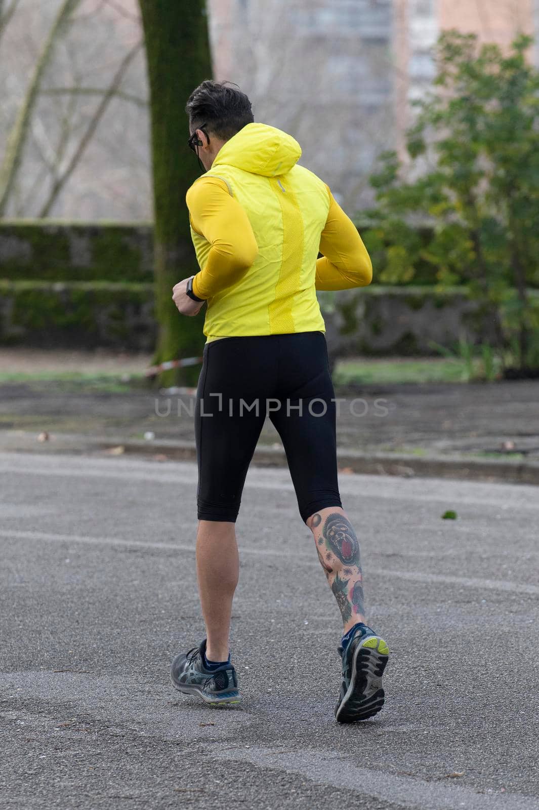 terni,italy february 11 2021:man runs to the park early in the morning