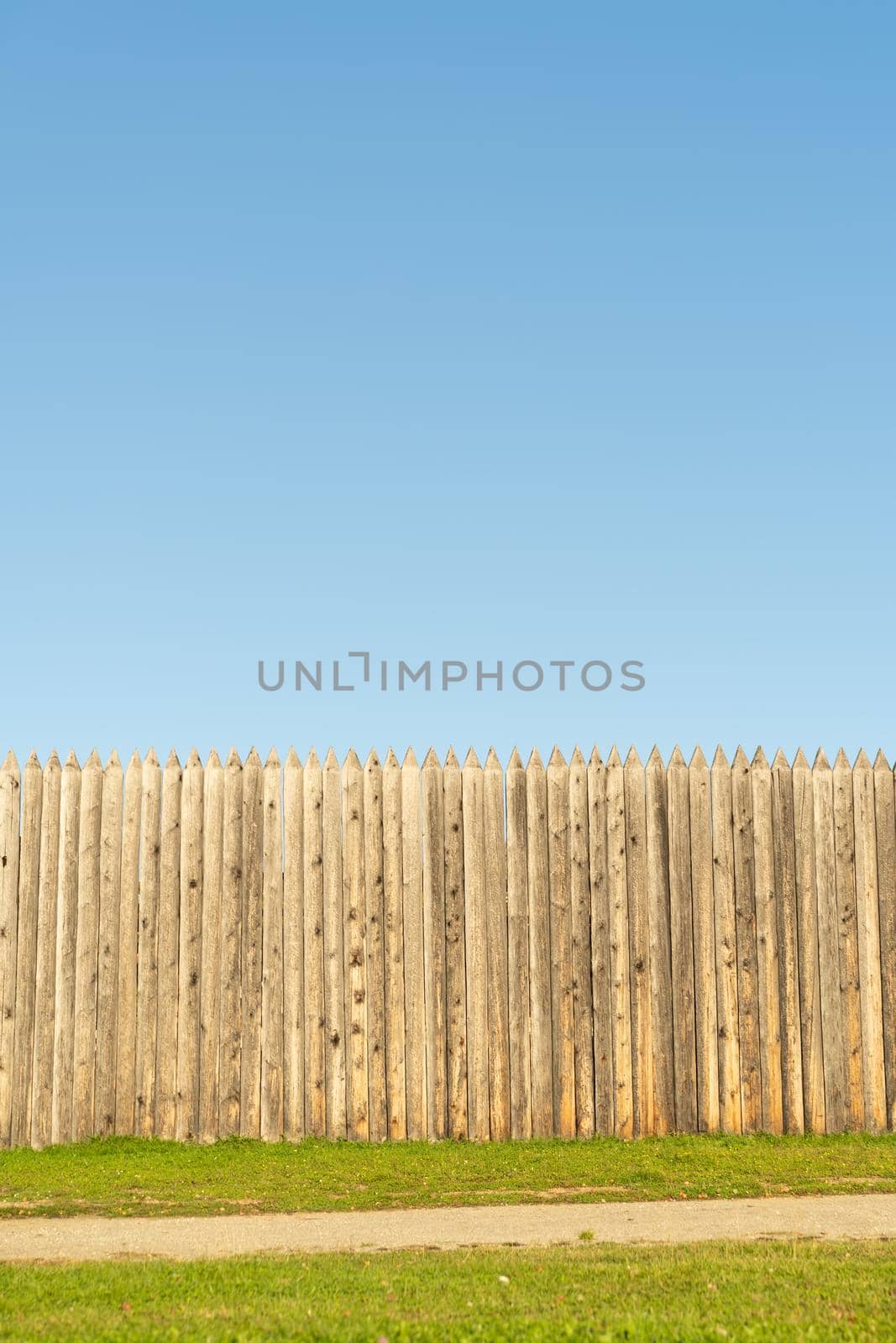 Wooden fence against the blue sky. For design and network