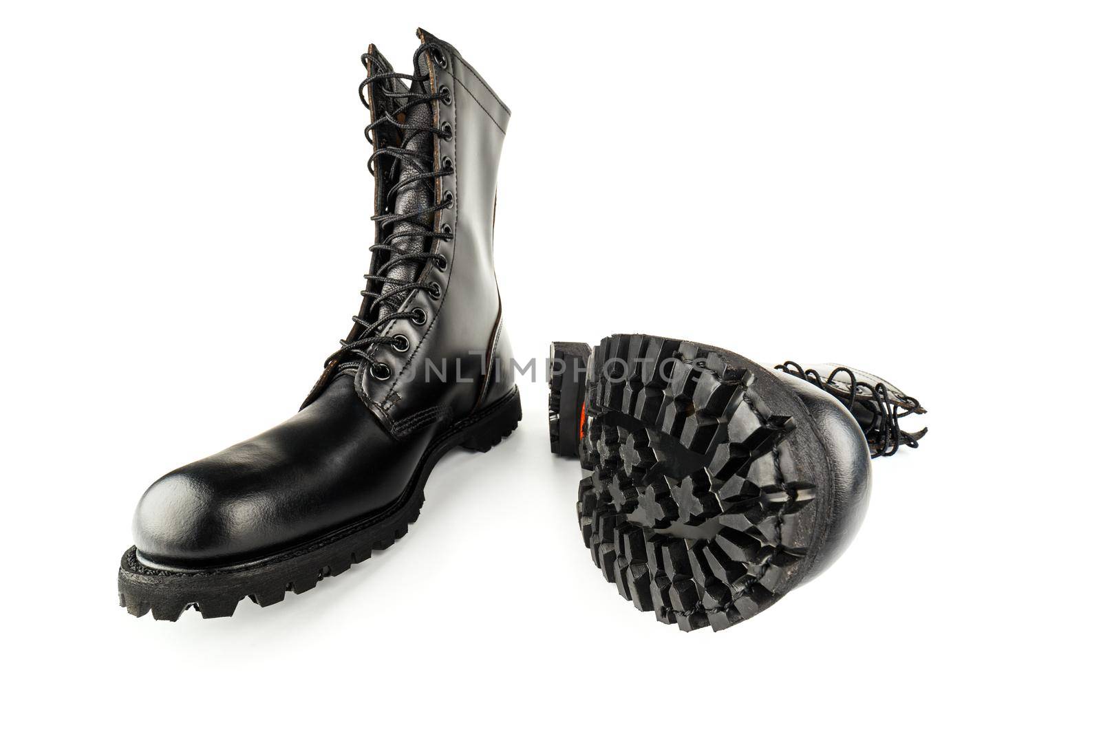 pair of black leather 10-inch new black military combat lug sole ankle jump boots, isolated on white background