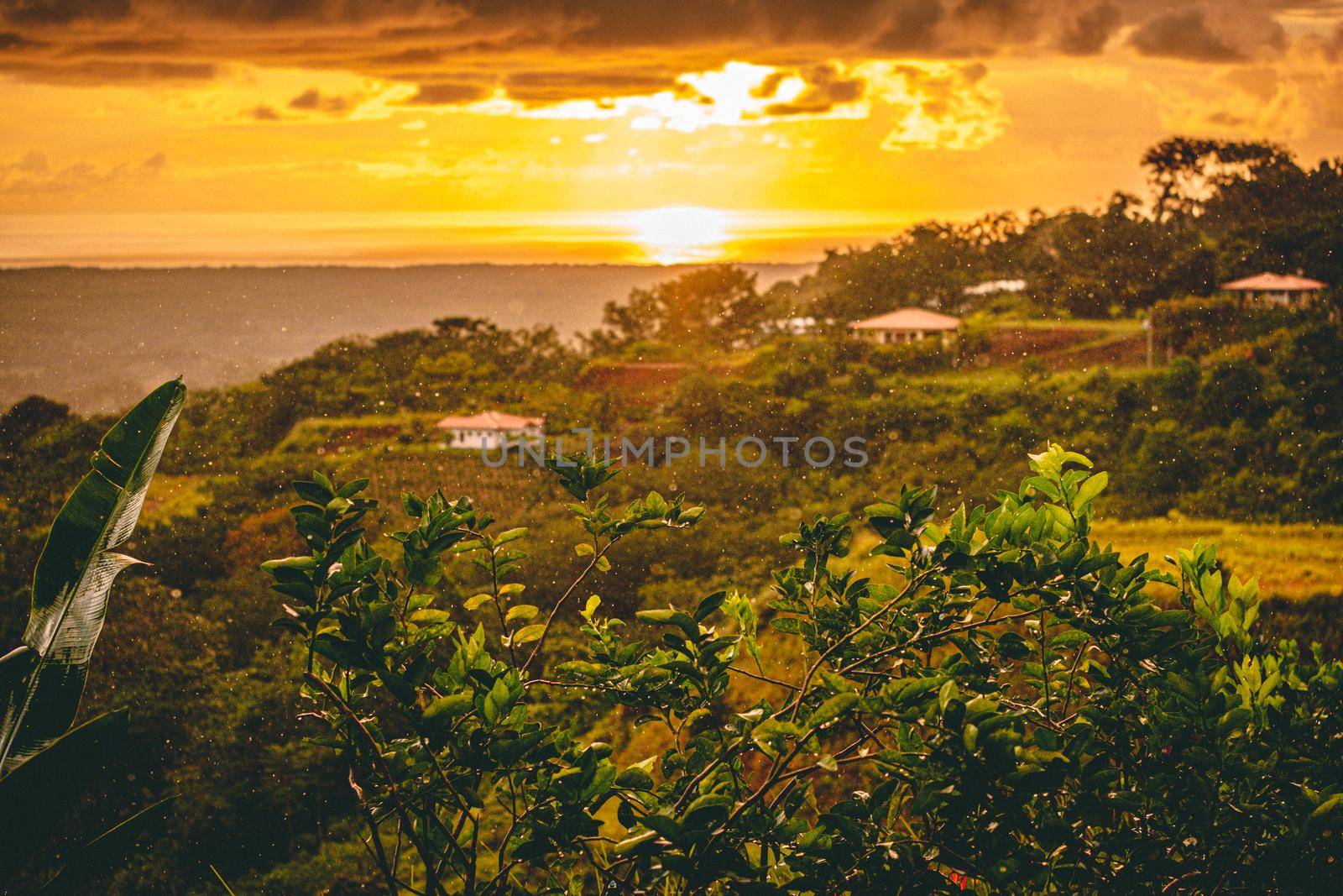 Amazing view from mountains in Costa rica to ocean and sunset during a summer rain. High quality photo
