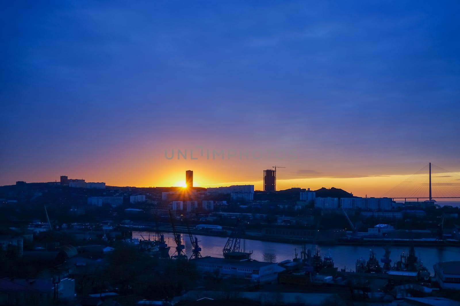 Cityscape of Vladivostok with a view of the dawn over the Bay of Diomede.