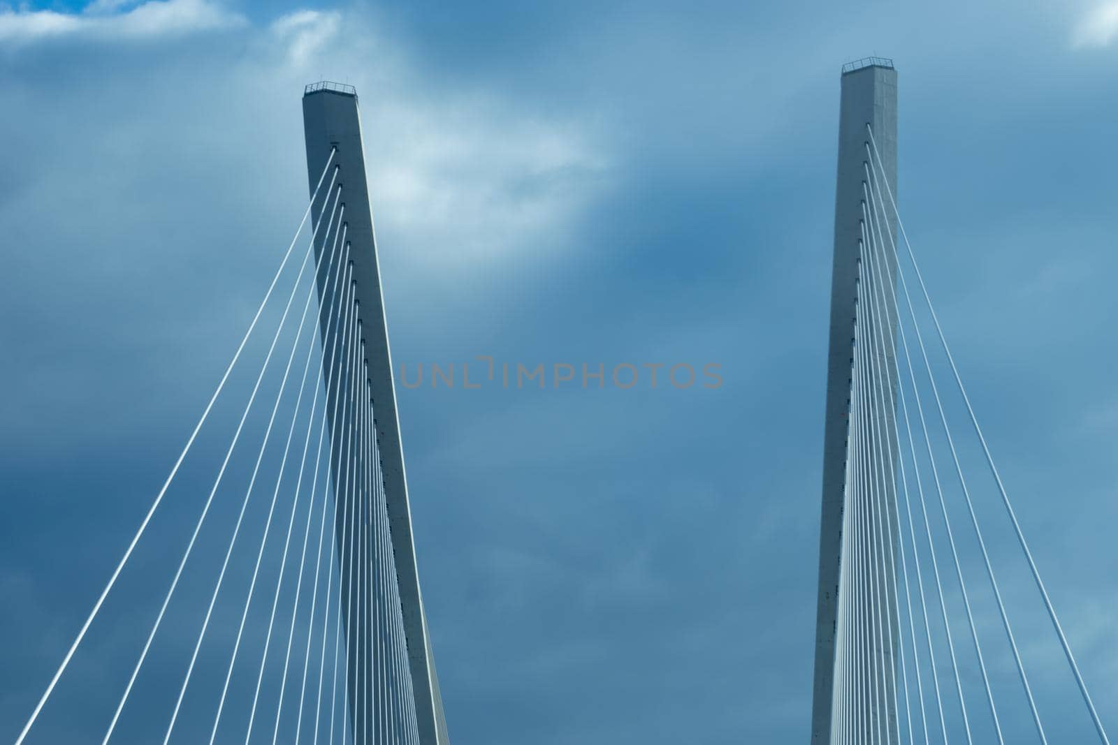 Construction of the Golden bridge against the blue sky. Vladivostok, Russia