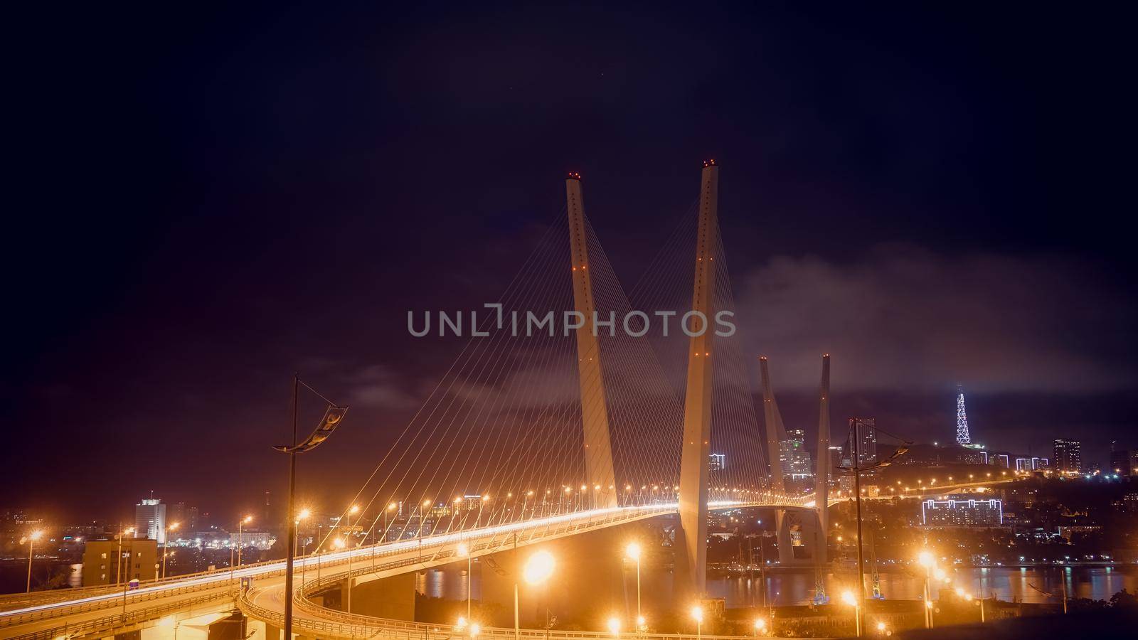 Vladivostok, Russia. Night landscape with a view of the Golden bridge.