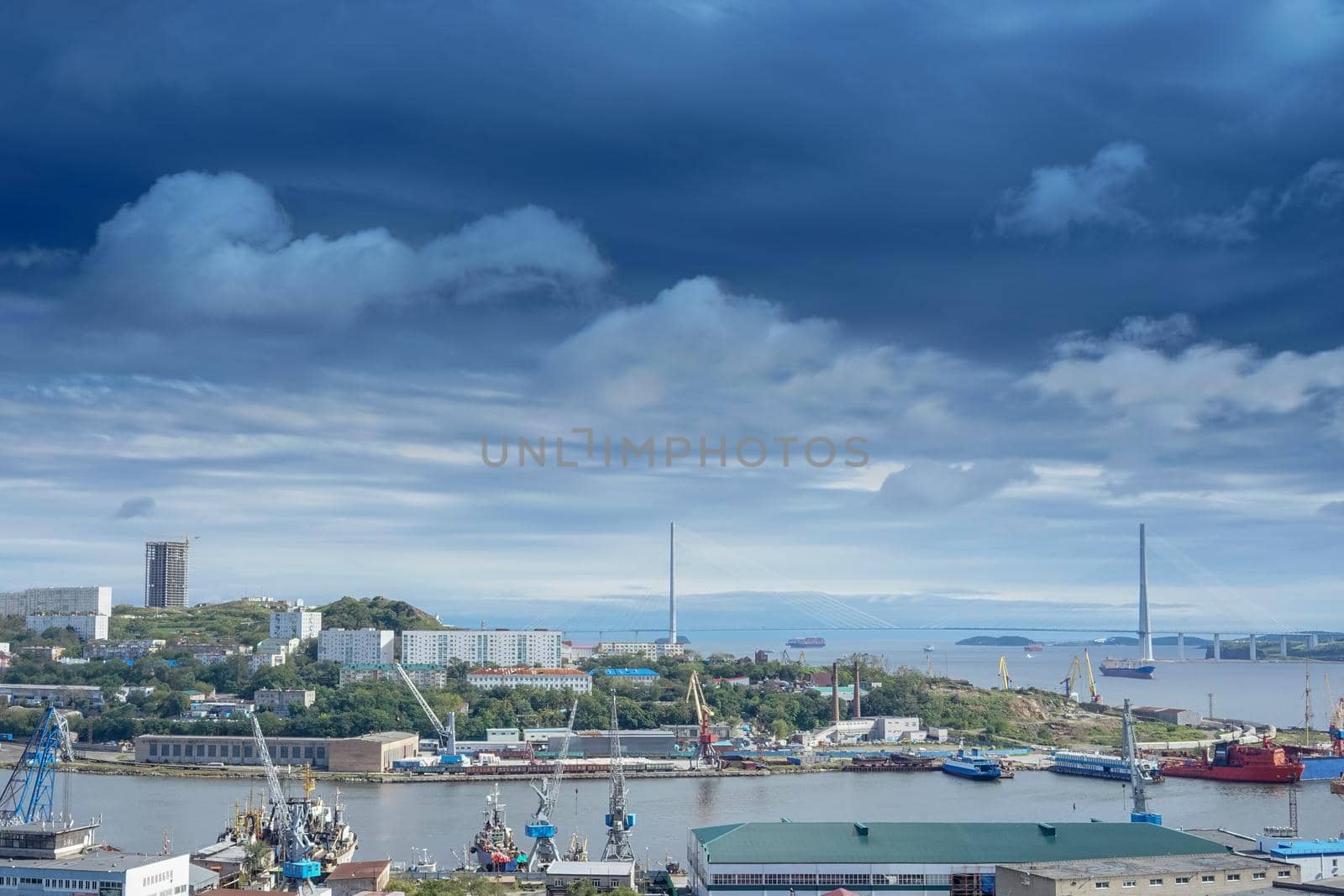 Vladivostok, Russia. Cityscape with views of the Bay of Diomedes and the Russian bridge. Magnificent sky over the city.