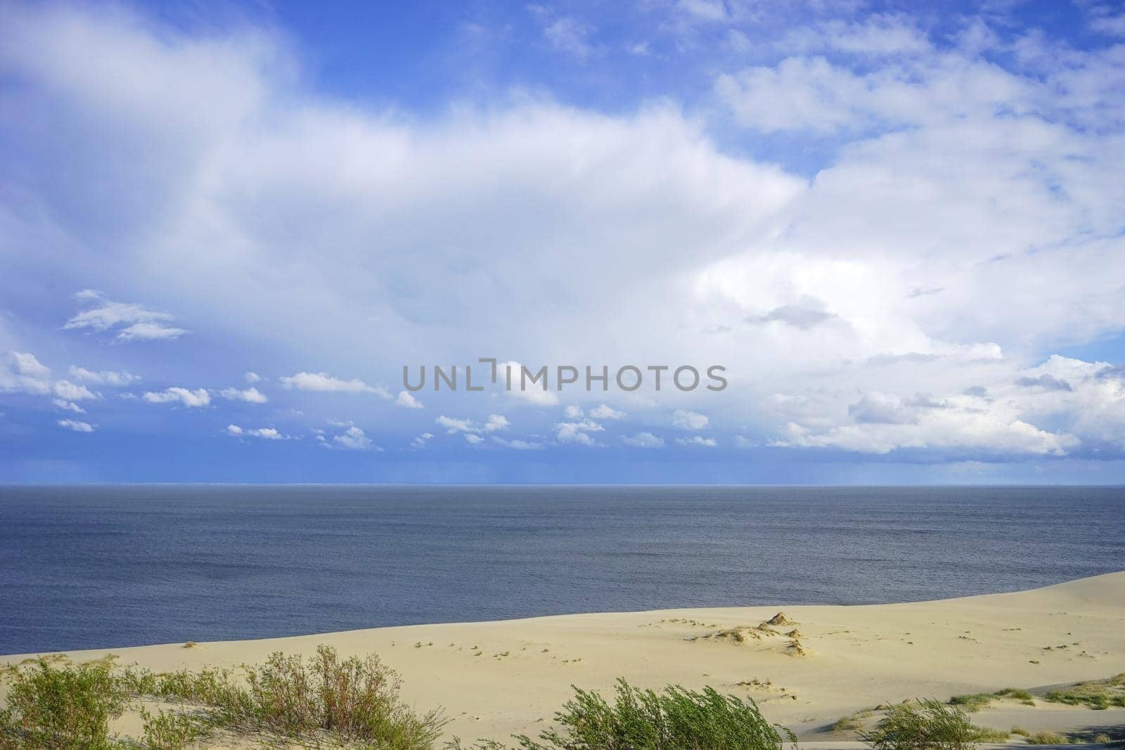 Deserted seascape on the Baltic sea and sand dunes