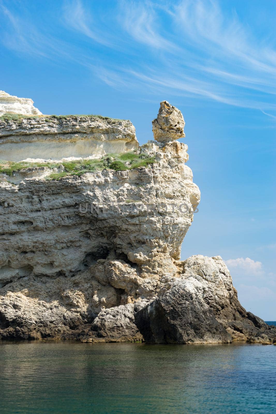Crimean landmark: Cape Tarkhankut with beautiful rocks on the background of the sea and sky.