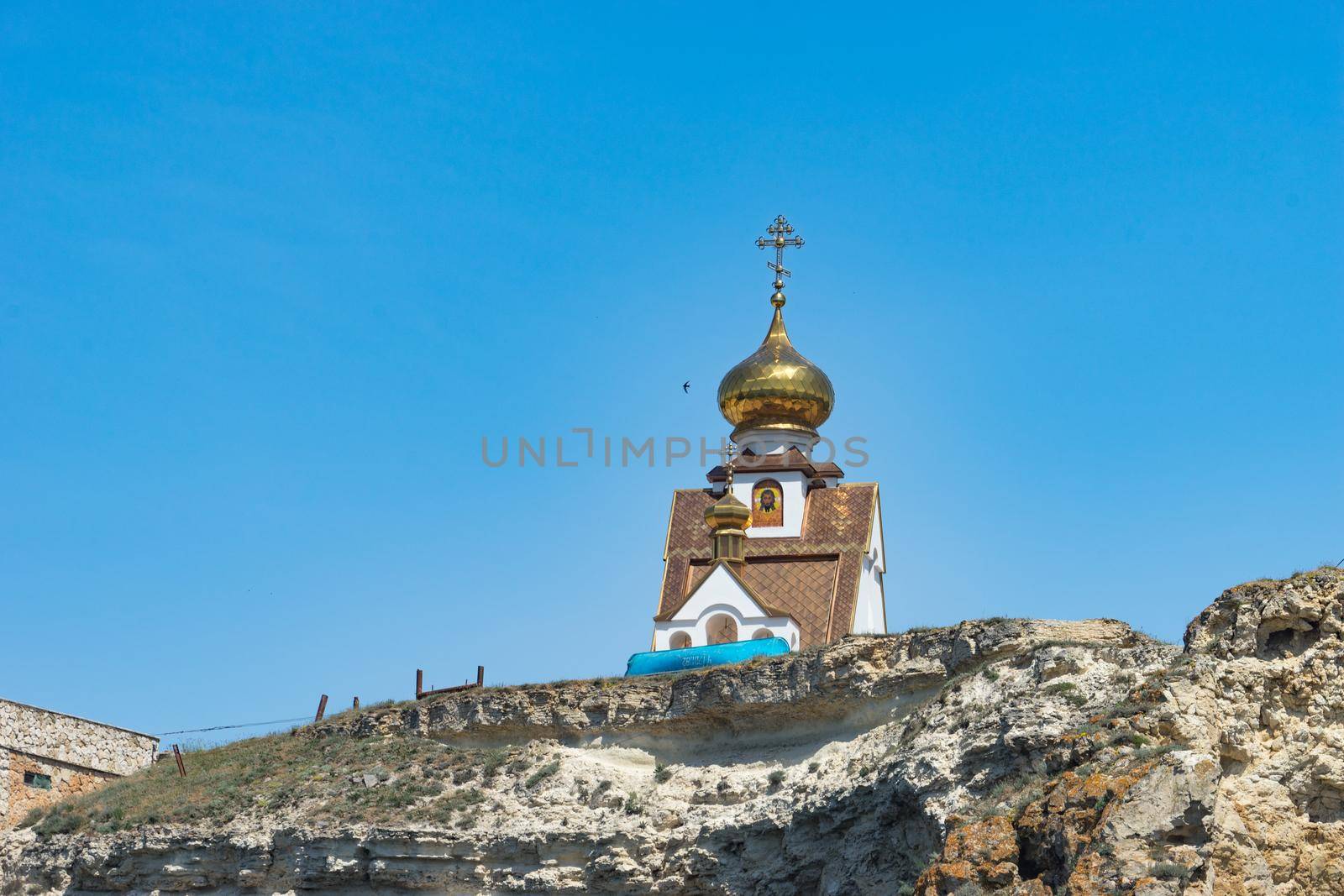 Crimean landmark: Cape Tarkhankut with beautiful rocks on the background of the sea and sky.