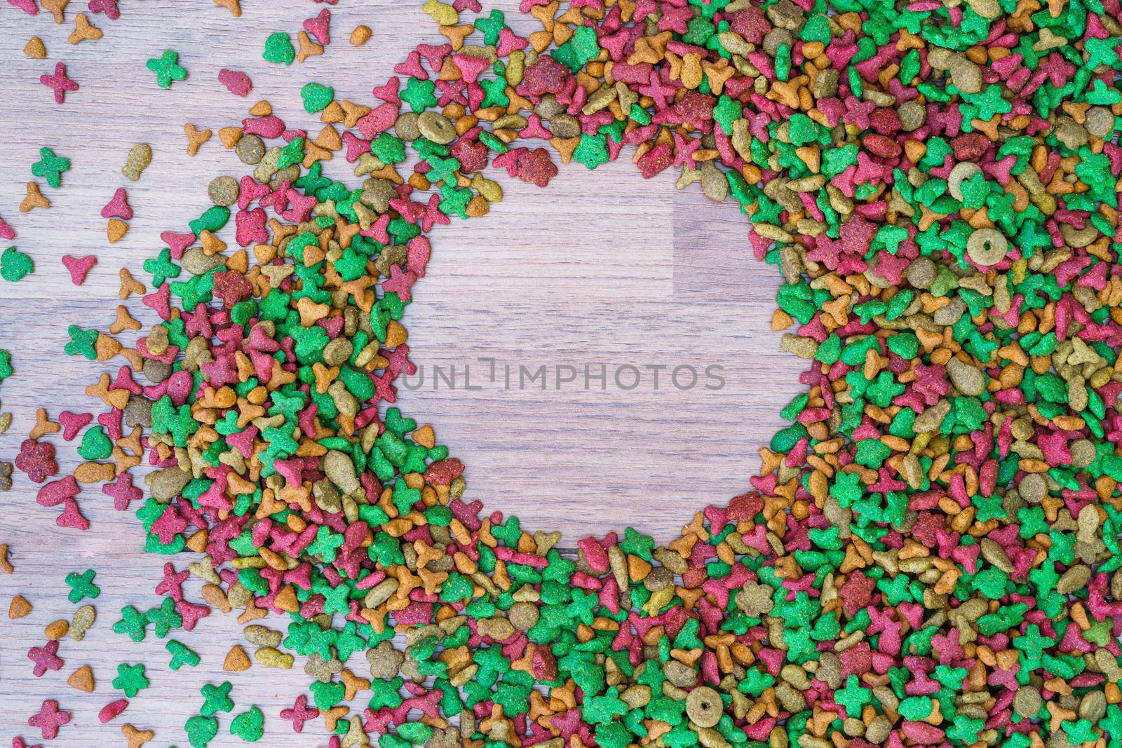 Top view dry cat food on wooden background with copy space