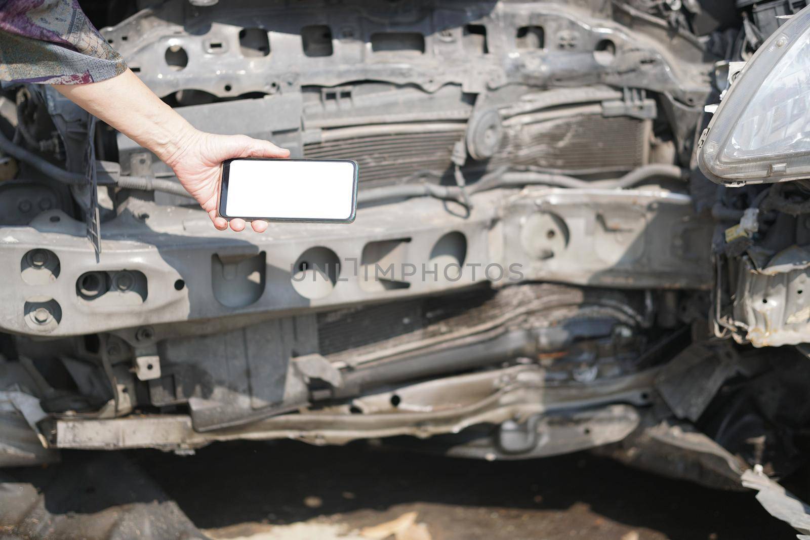 hand take photo of crashed damaged broken car. automobile crash collision accident