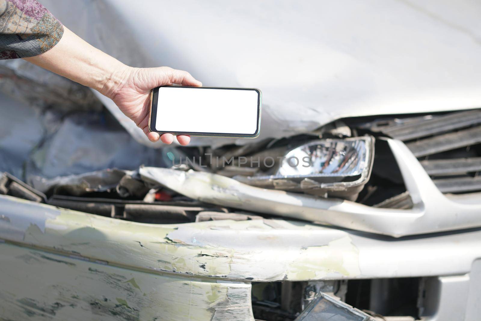 hand take photo of crashed damaged broken car. automobile crash collision accident