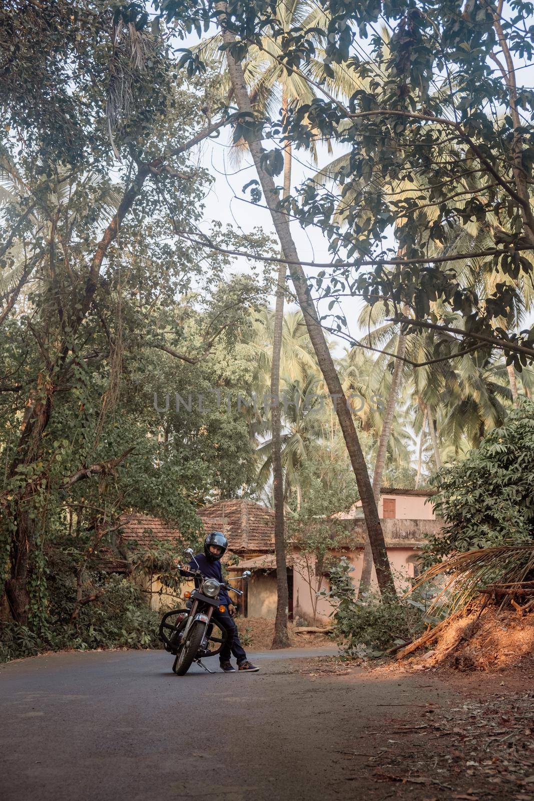 A Man On Motorcycle On Road in GOA village