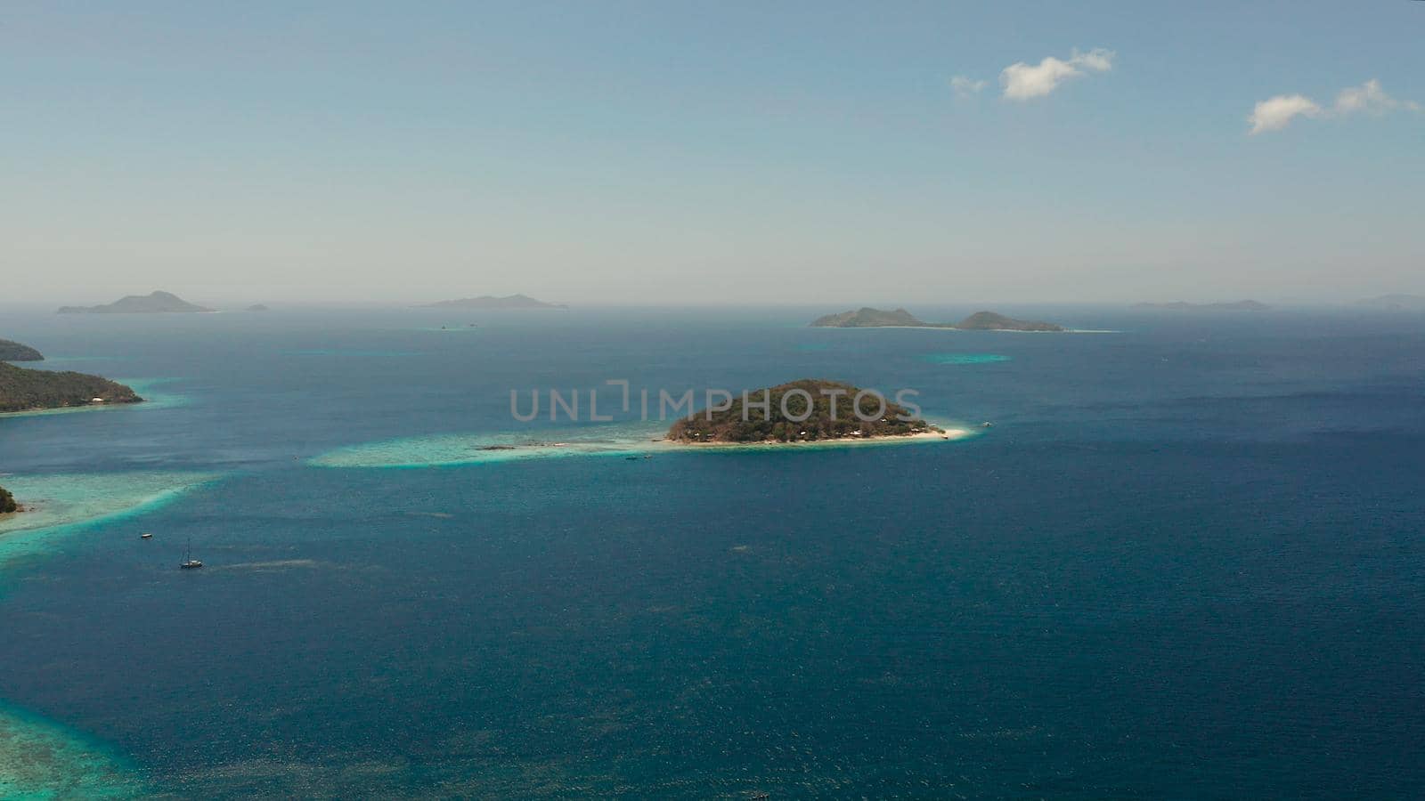 aerial view tropical beach with white sand and clear blue sea. tropical landscape with islands and beaches. Philippines, Palawan.