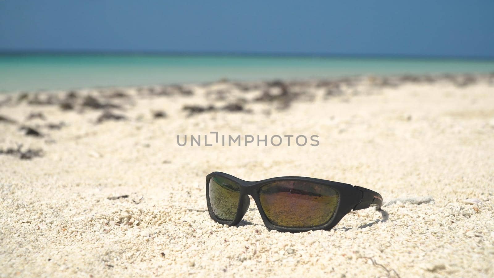 Tropical beach with white sand with beach house on a tropical island. Beautiful sky, sea. Seascape: Ocean and beautiful beach paradise. Philippines. Travel concept.