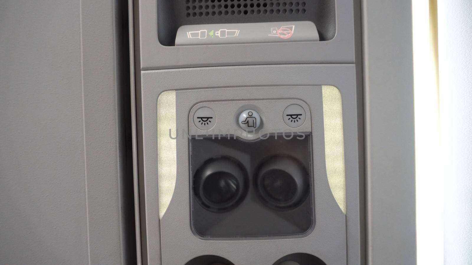 Overhead console of conditioner in a airplane. Fasten Seat belt. Symbol sign that be lighting for security on every flight trip