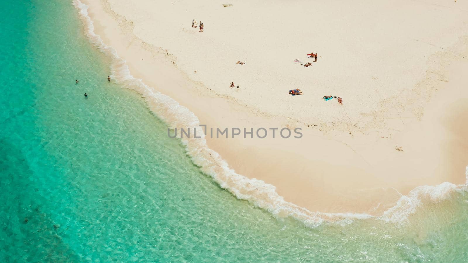 Tropical island with beautiful beach, and turquoise water view from above. Daco island, Philippines. Summer and travel vacation concept