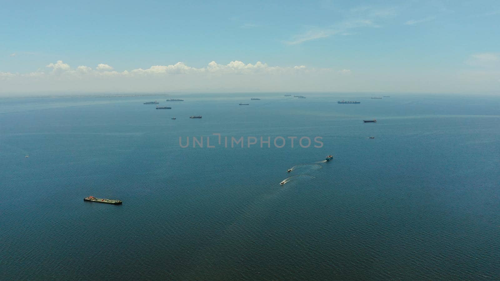 Arial view of ships at anchor in Manila Bay. Cargo ships in the harbor.