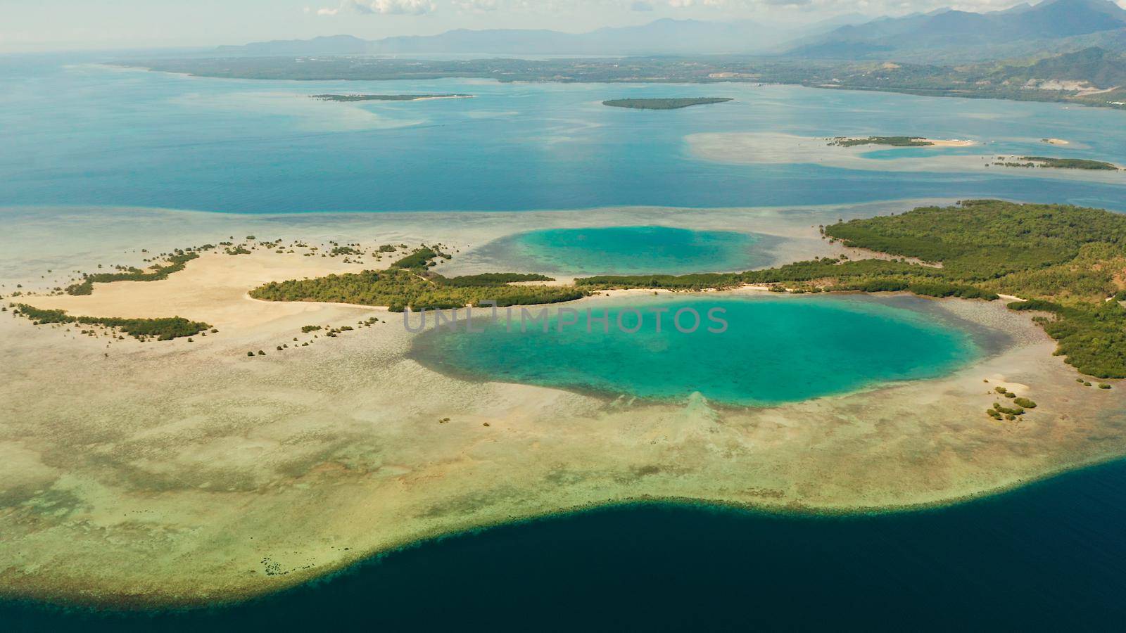 aerial view Honda bay with tropical islands and sandy beaches surrounded by coral reef with azure water. Summer and travel vacation concept, Puerto princesa, Palawan, Philippines.