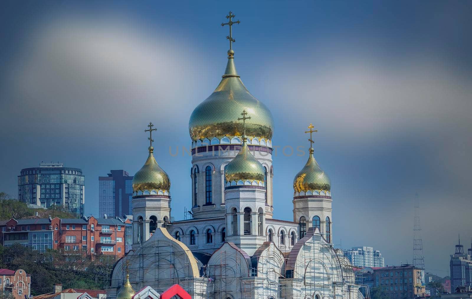 Vladivostok, Russia. The building of the temple under construction against the blue sky.