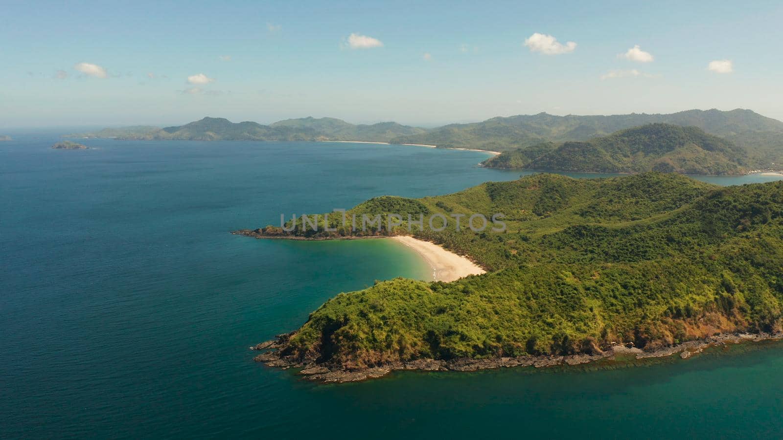 Sandy beach on tropical island, aerial view. El nido, Philippines, Palawan. Seascape with tropical island, ocean blue water. Summer and travel vacation concept